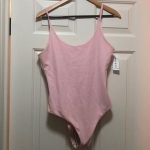 Baby pink swimsuit with low ruffled back